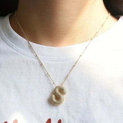 Conjunto de collares con iniciales de letras abombadas | Dorado