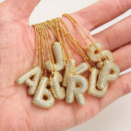 Conjunto de collares con iniciales de letras abombadas | Dorado