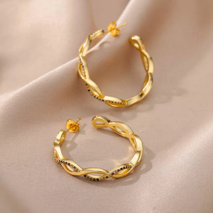 Julenyssa | Wave øreringe 18K guld