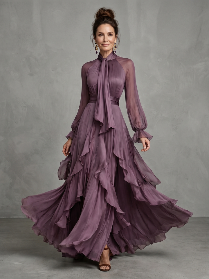 Demetria | Vestido maxi de volantes con cuello atado y capas