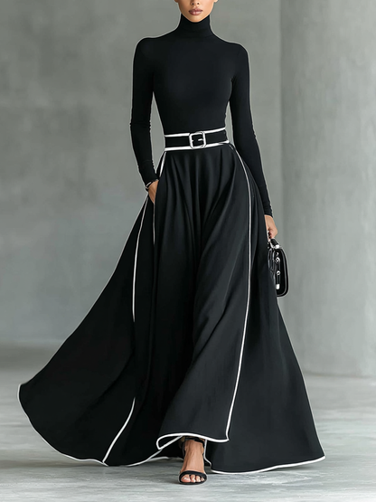 Damen-Maxikleid in Schwarz mit weißen Ziernähten, Stehkragen, langen Ärmeln und engem Taillengürtel