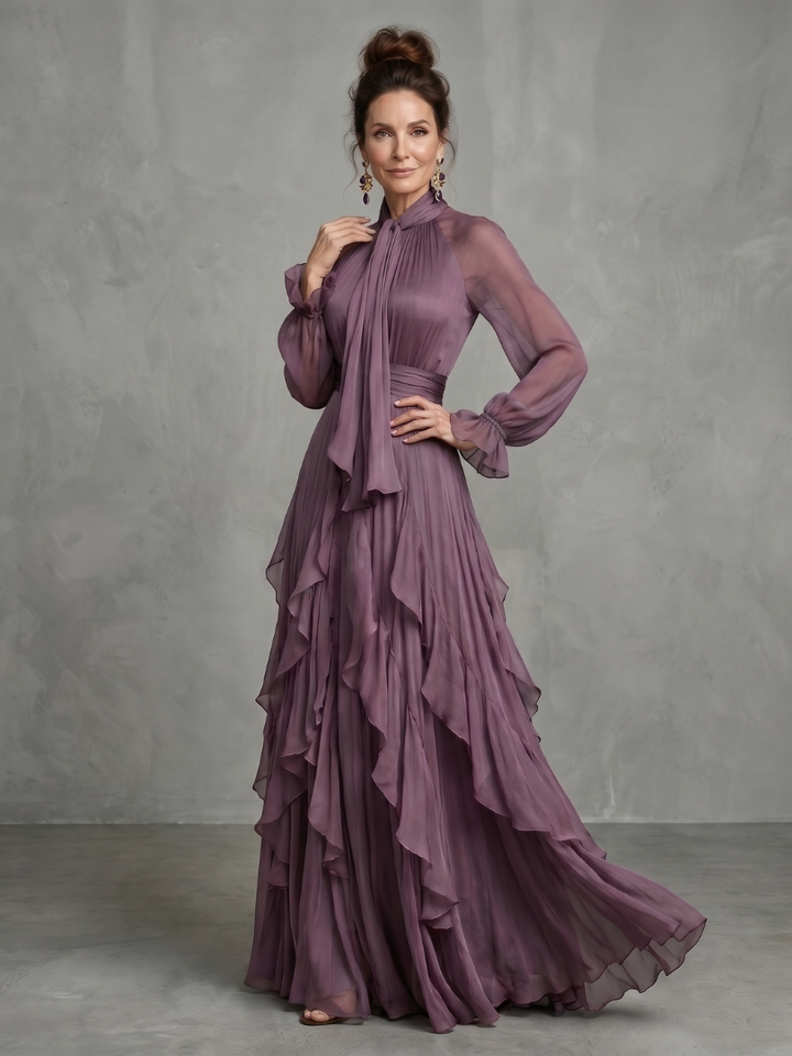 Demetria | Vestido maxi de volantes con cuello atado y capas