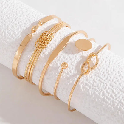 Juego de pulseras de elegancia anudada | Dorado