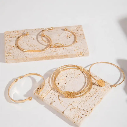 Juego de pulseras de elegancia anudada | Dorado