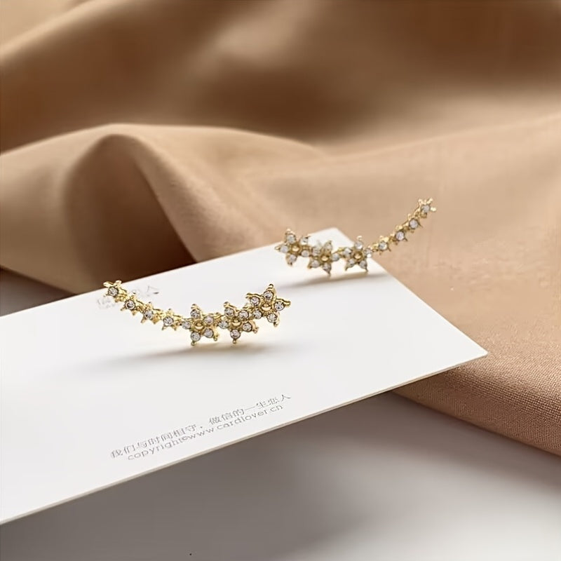Pendientes dorados con flores y pedrería rhinestone