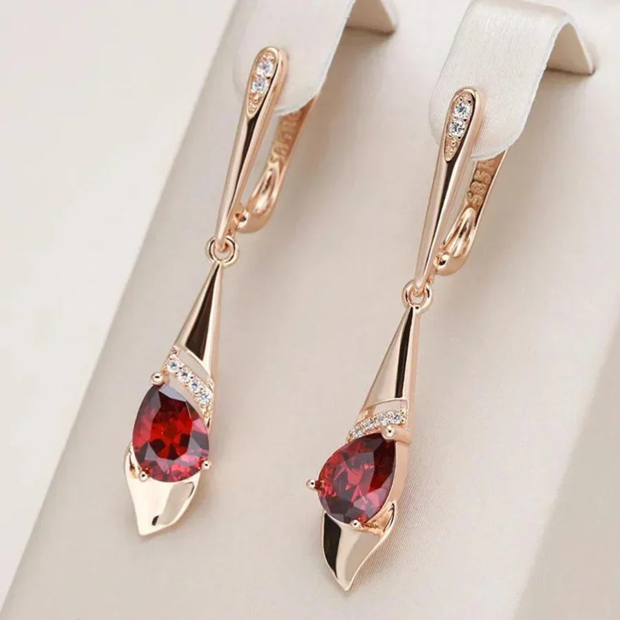 Elegante colgante con pendientes de cristal rojo | Oro