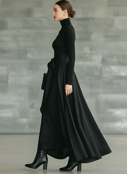 Vestido longo feminino preto, de gola alta, malha de alta elasticidade e tecido acetinado, com saia evasê