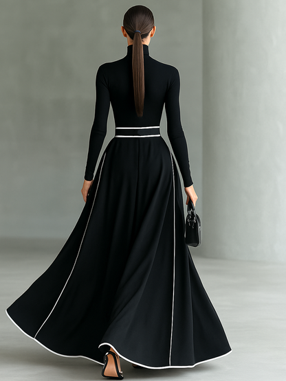 Damen-Maxikleid in Schwarz mit weißen Ziernähten, Stehkragen, langen Ärmeln und engem Taillengürtel