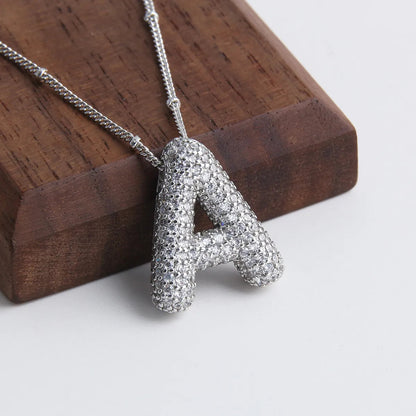 Juego de collares con iniciales de letras burbuja | Oro blanco