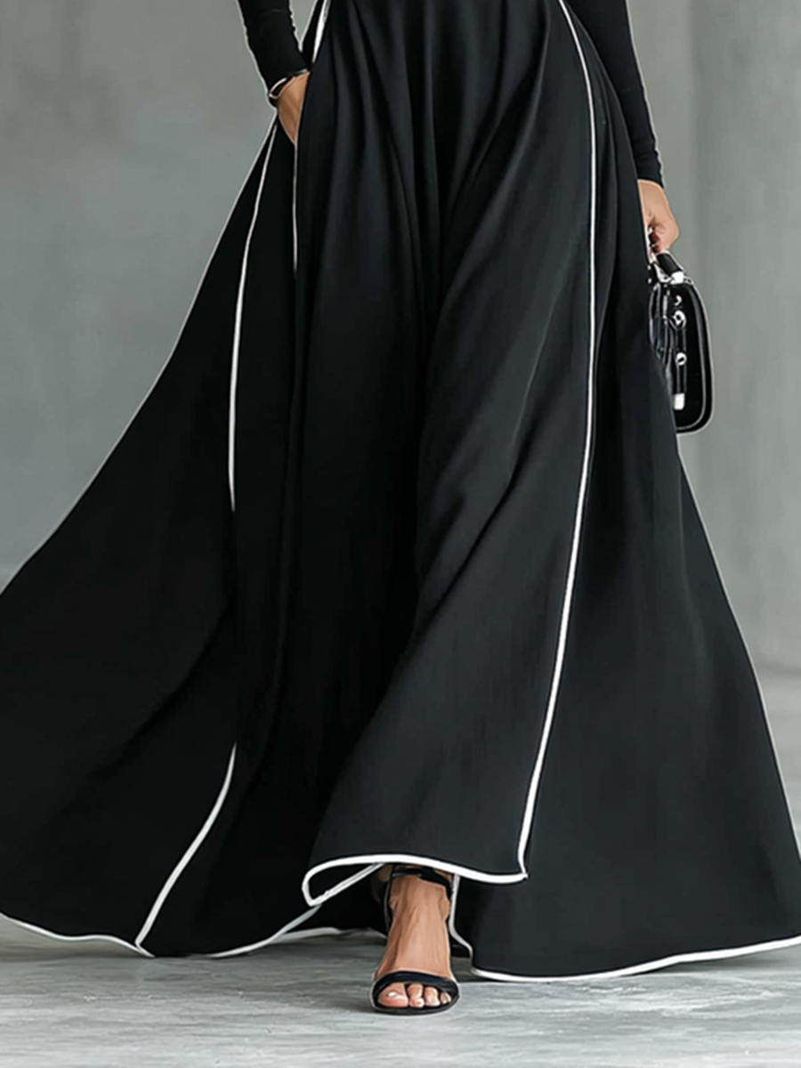 Damen-Maxikleid in Schwarz mit weißen Ziernähten, Stehkragen, langen Ärmeln und engem Taillengürtel