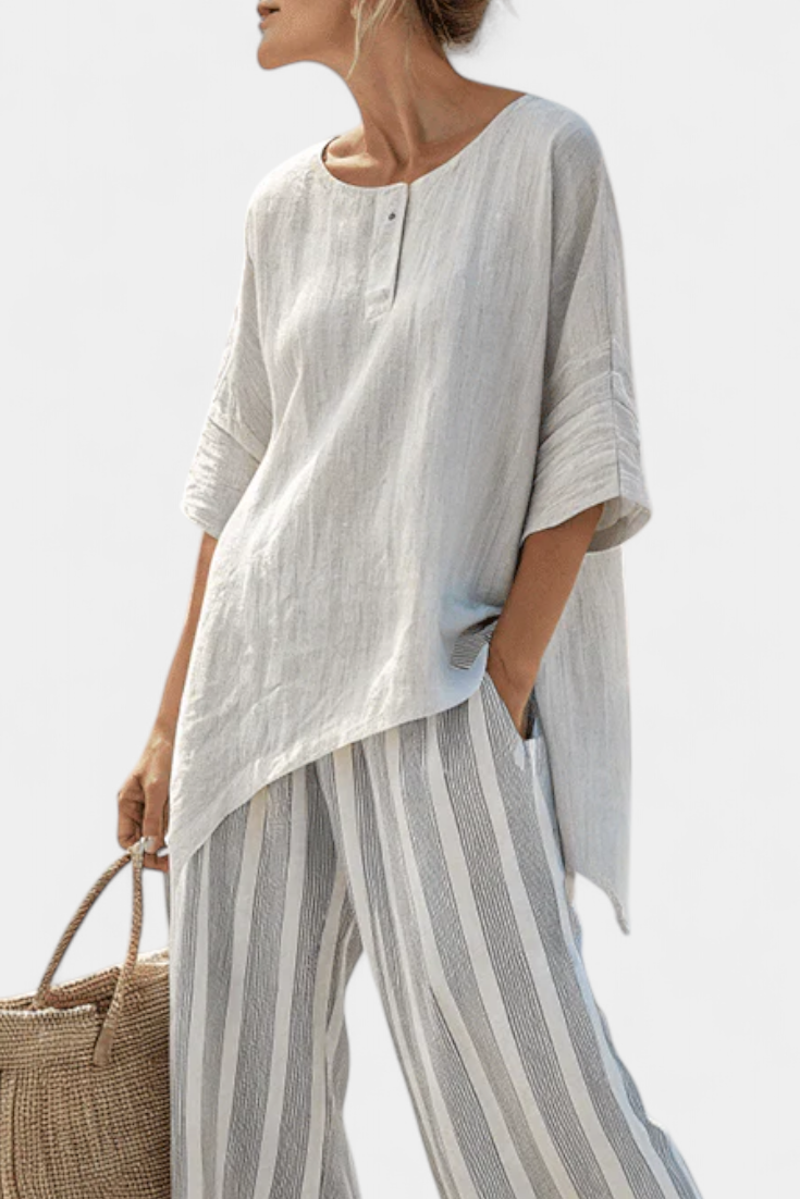 Talvora | Elegant asymmetrisk bluse og stribede bukser