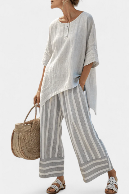 Talvora | Elegant asymmetrisk bluse og stribede bukser